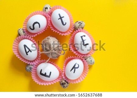 Bright Easter image with fresh spring flowers on the yellow background. White eggs with text - Easter on the bright colorful background