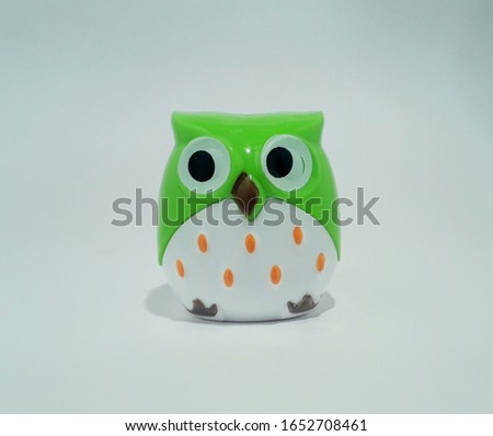 Plastic Toy of an Owl with white background