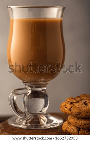 Coffee break composition with glass coffee with milk. Toned photo