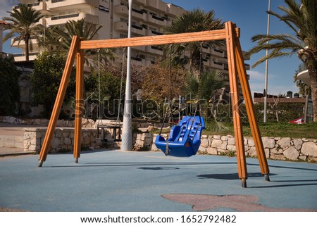 Swing in a children playground Royalty-Free Stock Photo #1652792482