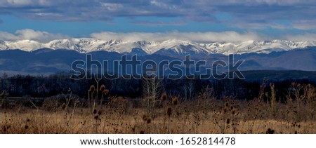 Beautiful mountain landscape. Snow covered mountains photographed from a distance. Panoramic image. Somewere in Austria