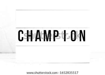 Champion flat lay on a white background.  Motivational. Success. Retro