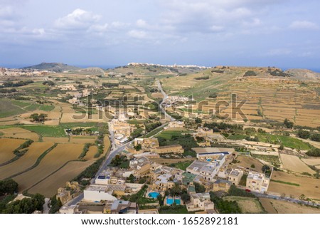 Aerial top drone shot of rural landscape of the island of Gozo Malta in summer
