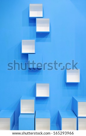 3D blue and white cubes in a random pattern on a blue background