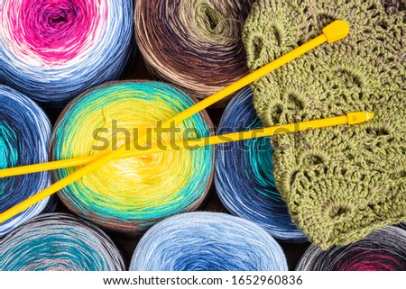 Background with balls of wool of various colors for knitting.