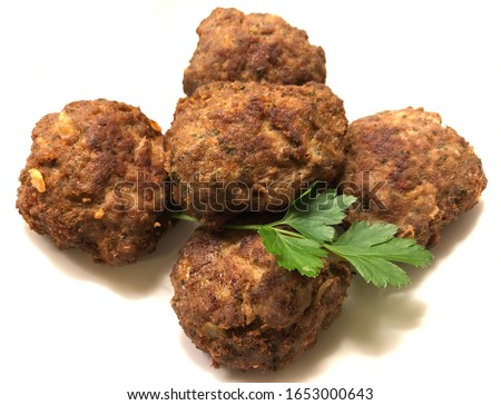 Beef minced meat patties als rissoles with parsley. The classic ingredients are minced beef meat, slices of white bread soaked, roasted onions, black pepper from the mill, salt, garlic and parsley.