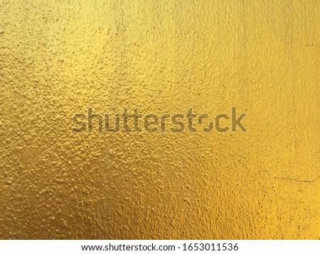 Golden cement wall surface texture background