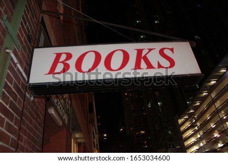 Book sign lit up at night