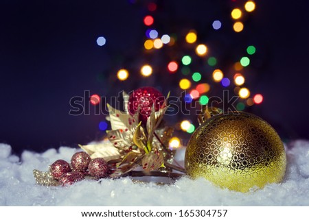 Christmas decoration with golden ball and branch