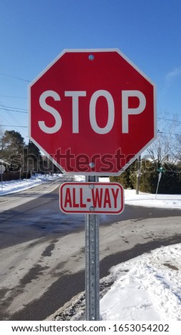 A red stop sign, all-way stop