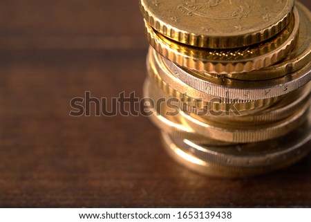 Euro coins stacked on each other in different positions Royalty-Free Stock Photo #1653139438