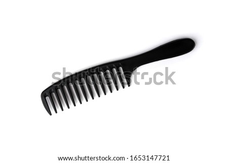 Black comb isolated on white background.