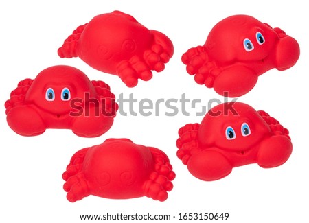 Bath toy on a white background, red crab. a bath toy