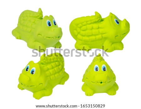 Toy for the bathroom on a white background, green crocodile. a bath toy