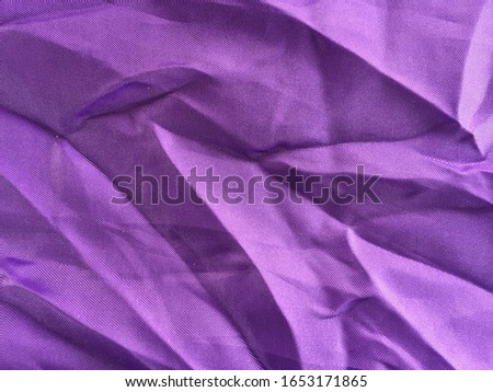 The Purple canvas with a creases because the crease must be washed.