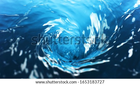 Water twister, freeze motion of rotating water surface. Refreshment and drink. Royalty-Free Stock Photo #1653183727