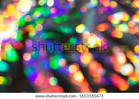 Delicate glitter bokeh rainbow background. Creative and moody color of the picture. Blurred texture.