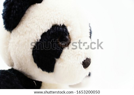 Black and white panda bear soft toy

