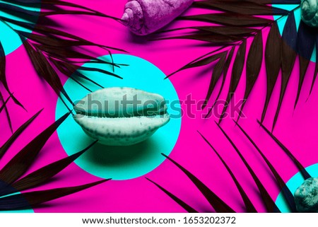 Flat lay traveler accessories with palm leaf, seashells . Top view travel or vacation concept. Summer background. Toned
