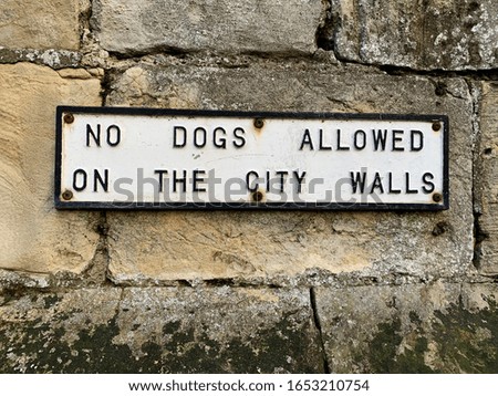 No dogs allowed on the City Walls sign on the Bar Walls in City of York