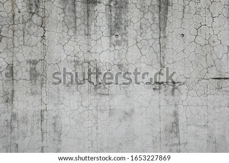Cracked concrete wall, background material