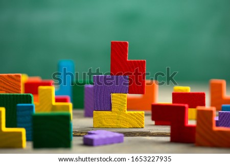 Creative solution for idea - business concept, jigsaw puzzle on the green blackboard background Royalty-Free Stock Photo #1653227935