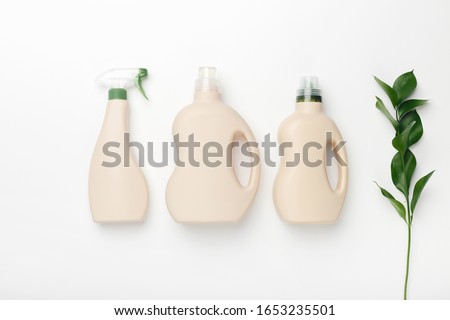Set of bottles with mockup packaging, cleaning detergent on white background. Cleaning tools, cleanliness Royalty-Free Stock Photo #1653235501