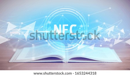 Open book with NFC abbreviation, modern technology concept