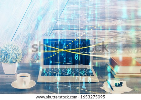 Double exposure of desktop computer and technology theme hologram. Concept of software development.