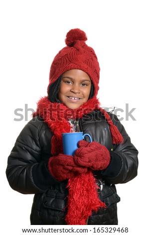 little girl holding hot chocolate drink