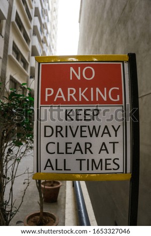 No parking sign board with white and red color