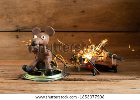Rats from plasticine holding a power cord.breaking the wires.Electric shock,An explosion,Fire.