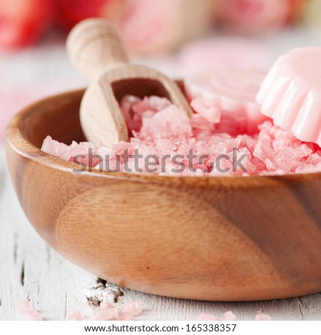 Spa with pink flower salt and soap, selective focus and square image