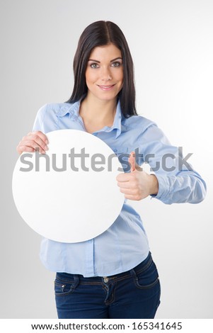 young woman with blank circle board and showing thumb up sign