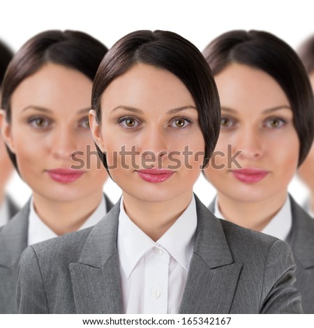 Group of business women clones standing in a row