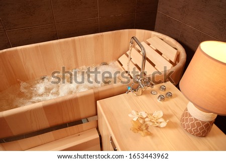 Hydro massage in a wooden bath, for relaxation and relaxation in the Spa