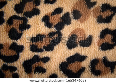 Closeup of native style material with leopard print design