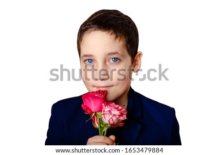 Adorable boy holds flowers. Photo isolated on white background. Concept of holidays and birthday.