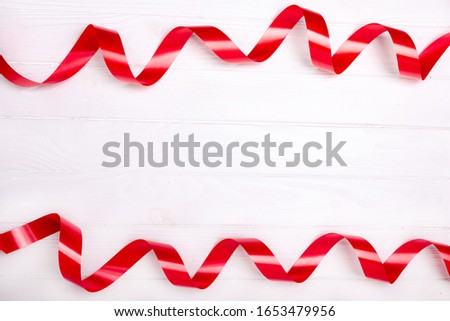 Red satin ribbon isolated on white background