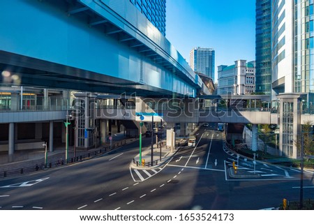 Japan. Tokyo. Transition between office buildings. Downtown. Business centers in skyscrapers in the capital of Japan. Buildings and roads in Tokyo. Urban architecture. Urban infrastructure of Tokyo.
