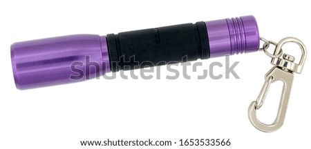 Electric flashlight with a LED on a white background  