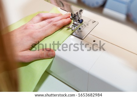 woman working on a sewing machine