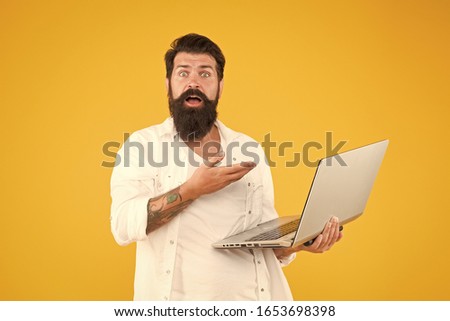 Programmer with laptop. Bearded man with notebook. Online shopping. Man using notebook. Surfing internet. In search of inspiration. Online payment. Online purchase. Digital world. Programming concept.