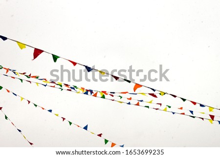 Multycolored flags Christmas, New Year, Shrovetide carnival pancake week Russian holiday Maslenitsa concept. Selective soft focus.Text copy space