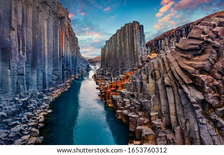 Fantastic summer sunset on Studlagil Canyon. Incredible evening view ofJokulsa A Bru river. Superb outdoor scene of Iceland, Europe. Beauty of nature concept background. Royalty-Free Stock Photo #1653760312