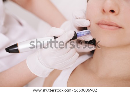 Cropped close up of unrecognizable woman getting mesotherapy procedure at beauty clinic Royalty-Free Stock Photo #1653806902