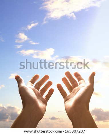 hands holding sky, close up