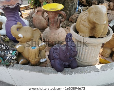 Pottery and animal sculptures in the Thai public park