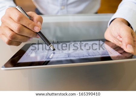 Architect working with stylus and digital tablet pc 