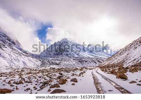 Snow covered beautiful landscape of Chandra river valley in Spiti during winter.  Spiti means 'The Middle Land' is a cold desert mountain valley located high in Himalayas of Himachal Pradesh, India. Royalty-Free Stock Photo #1653923818